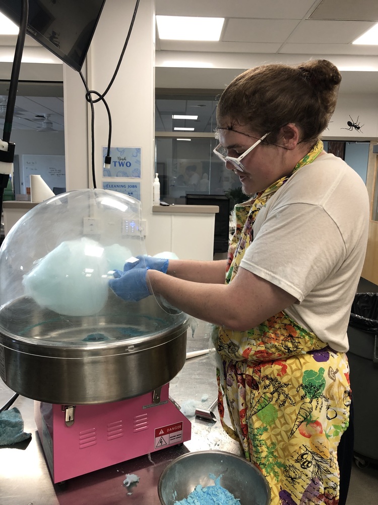 student making cotton candy