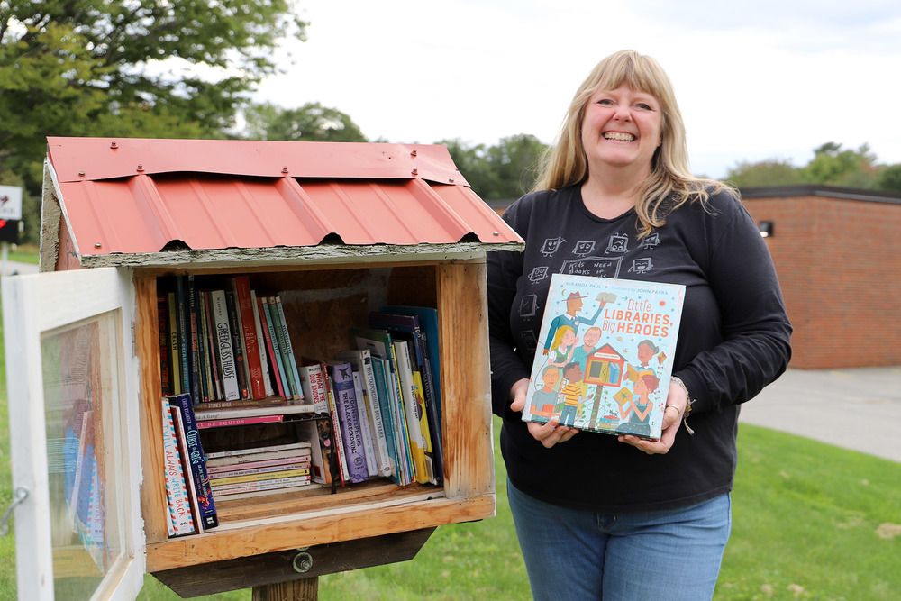 Sandi Brann at the Little Free Library