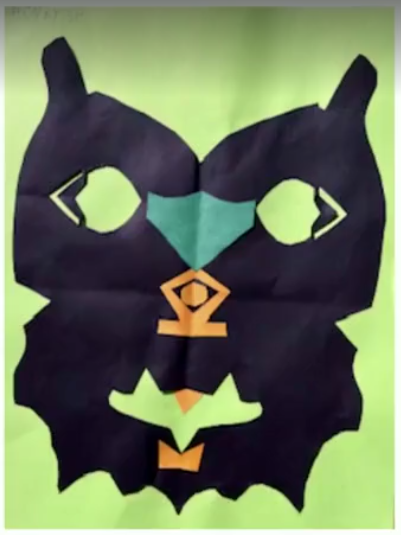 student art mask back on green background