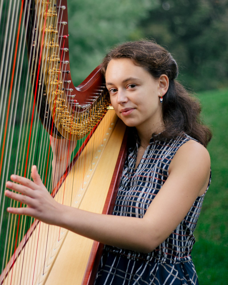 Rachel Ouellette of Morse High School playing a harp