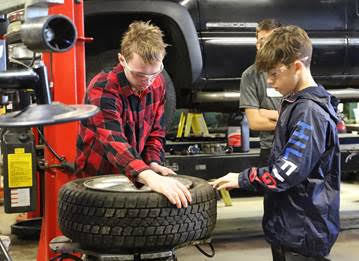 8th Graders work in the Automotive Shop at BRCTC during "Experience Day"