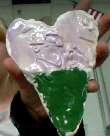 clay heart with pale pink and green glaze