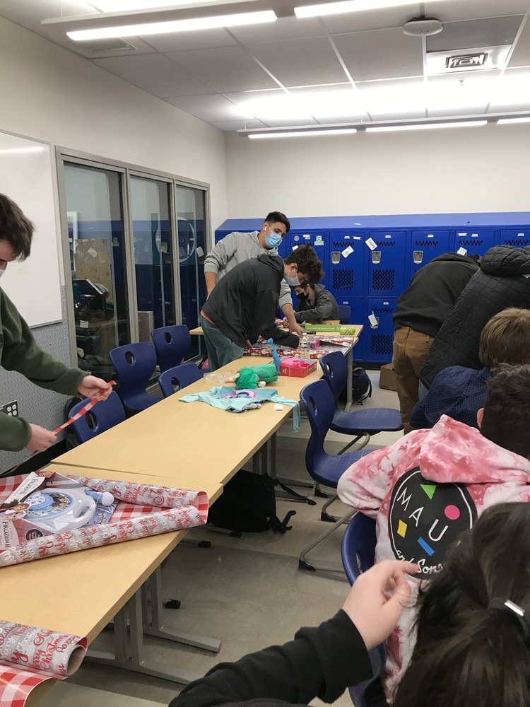 students wrapping gifts