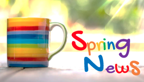  Rainbow coffee cup with spring news  off to the right  of the  cup 