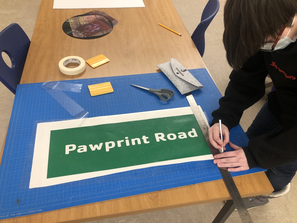 Student crafts a road sign for WCS