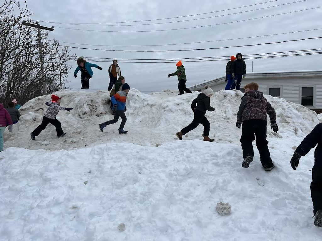 students snow play