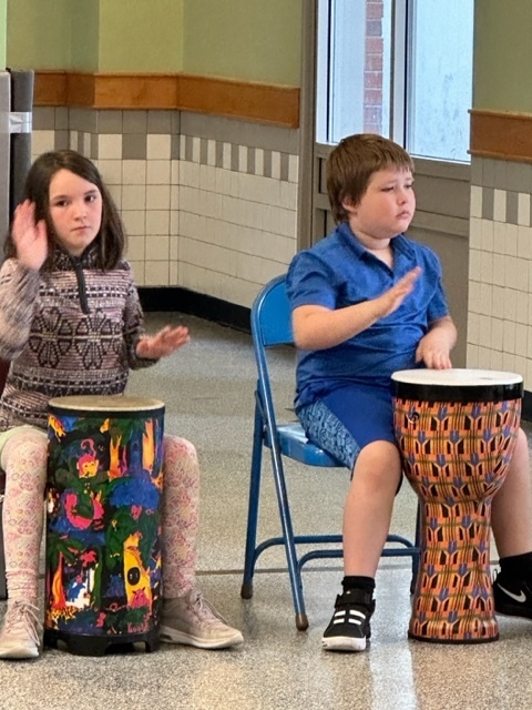 boy and girl playing drum