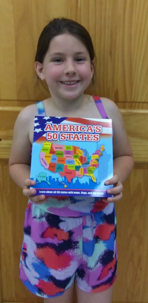 young girl holding book