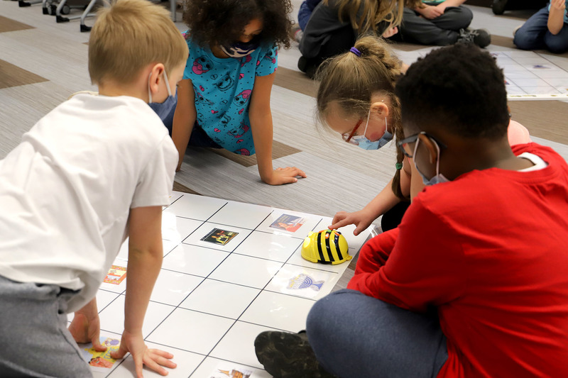  Photo: Sue Michaud’s second grade class at Dike Newell Elementary School learns the basics of sequencing with Bee-Bots.